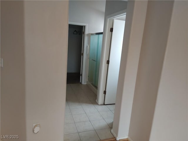 hallway with light tile patterned flooring
