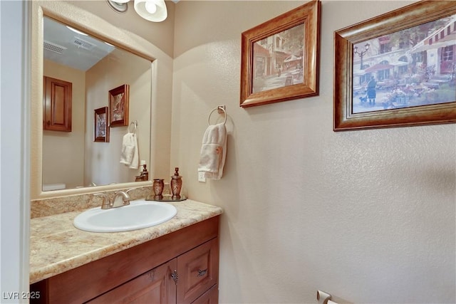 bathroom featuring vanity and visible vents