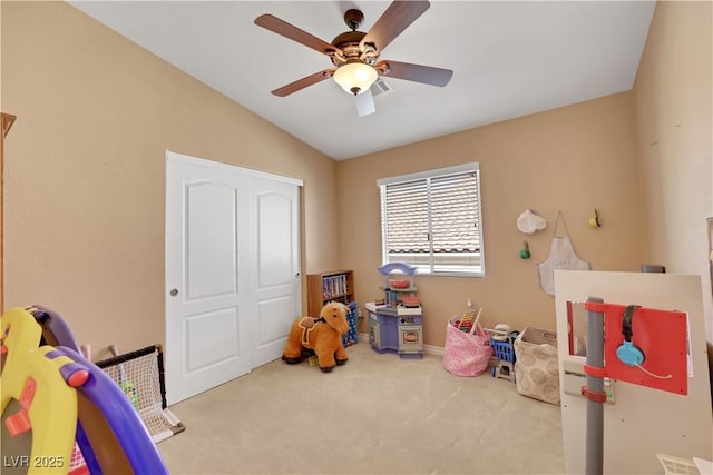 playroom featuring baseboards, carpet flooring, ceiling fan, and lofted ceiling