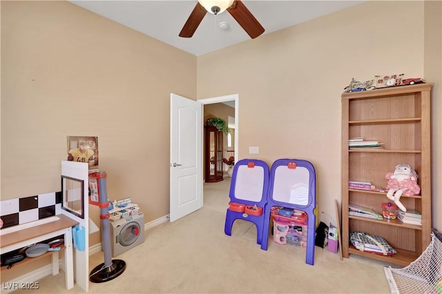 playroom featuring carpet, baseboards, and ceiling fan