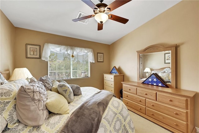 bedroom featuring carpet flooring, visible vents, and a ceiling fan