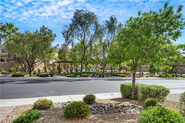 view of street with sidewalks and curbs