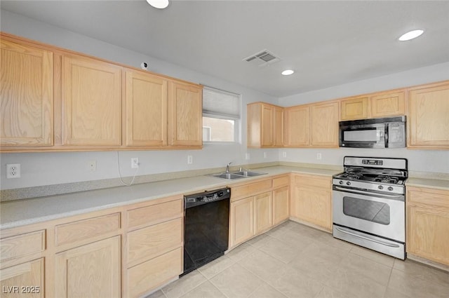 kitchen featuring a sink, visible vents, black appliances, and light brown cabinetry