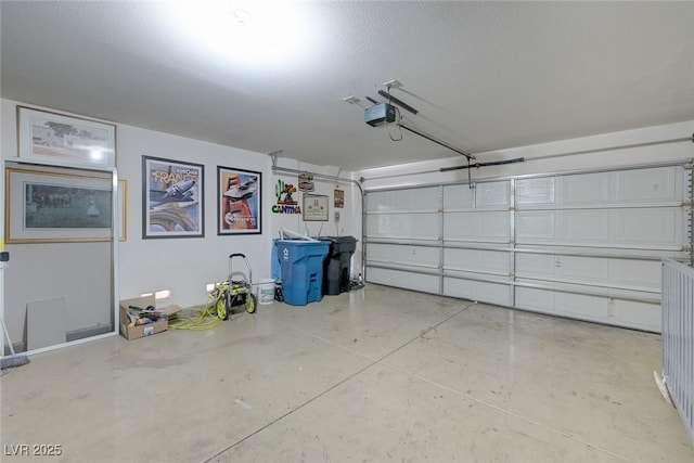 garage featuring a garage door opener