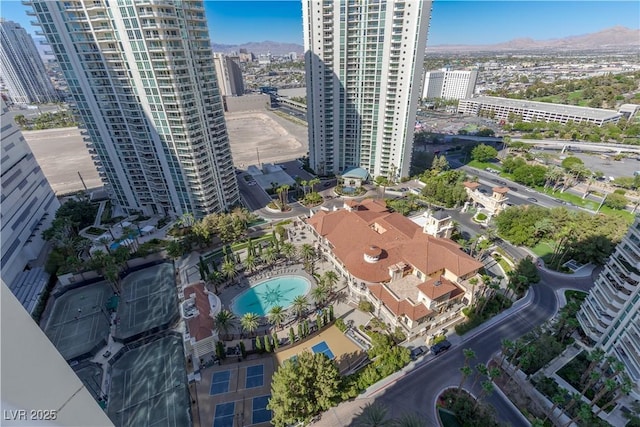 birds eye view of property with a mountain view and a view of city