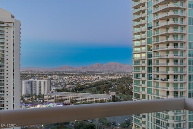 property's view of city with a mountain view