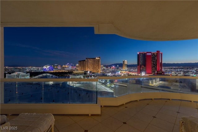 view of pool with a view of city lights
