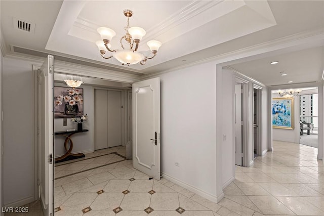 2877 Paradise Rd Unit 2502, Las Vegas, NV 89109 - hall with a chandelier, a tray ceiling, light tile patterned flooring, baseboards, and crown molding