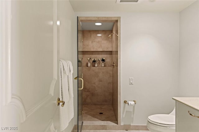 2877 Paradise Rd Unit 2502, Las Vegas, NV 89109 - bathroom featuring toilet, a stall shower, vanity, and tile patterned flooring