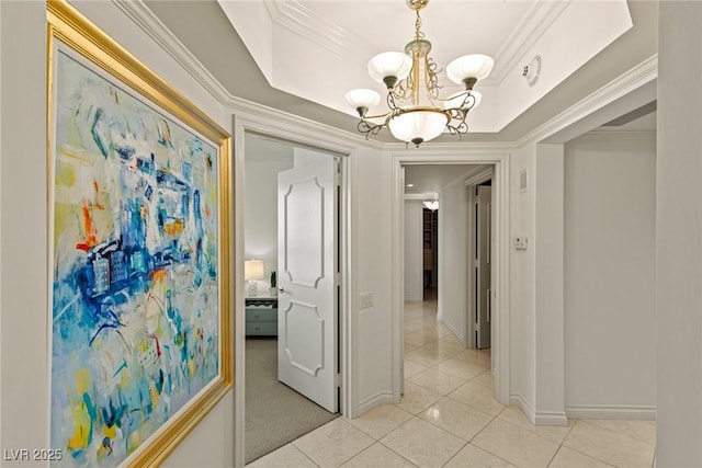 2877 Paradise Rd Unit 2502, Las Vegas, NV 89109 - corridor with a chandelier, light tile patterned floors, crown molding, baseboards, and a tray ceiling