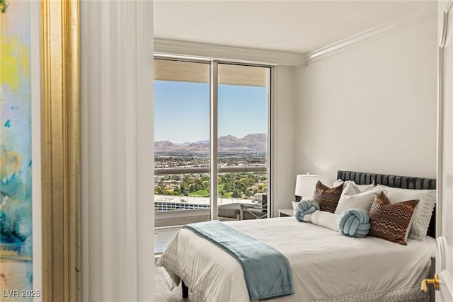 2877 Paradise Rd Unit 2502, Las Vegas, NV 89109 - bedroom with a mountain view, crown molding, and expansive windows