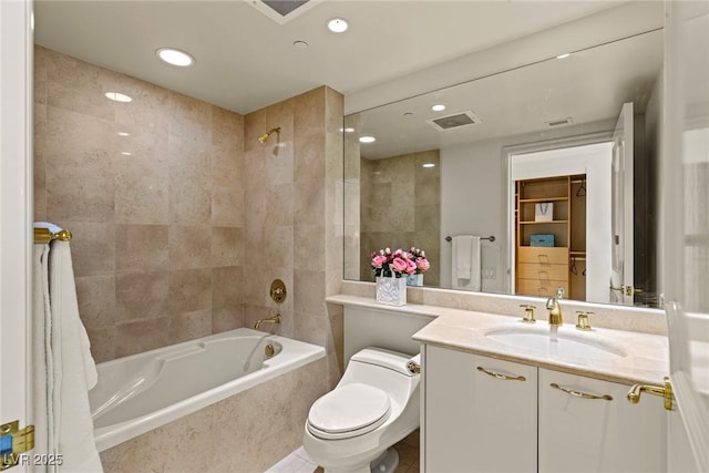 2877 Paradise Rd Unit 2502, Las Vegas, NV 89109 - bathroom featuring tiled shower / bath, vanity, recessed lighting, and toilet