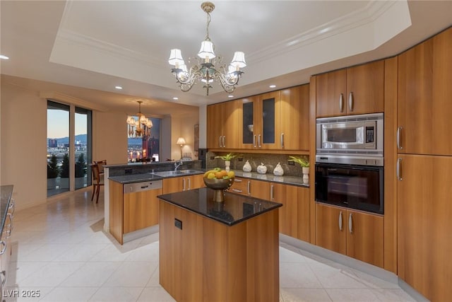 2877 Paradise Rd Unit 2502, Las Vegas, NV 89109 - kitchen with stainless steel appliances, a chandelier, brown cabinets, recessed lighting, and crown molding