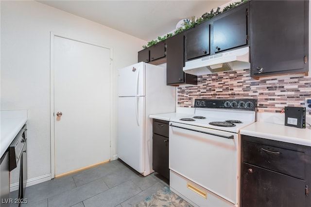 kitchen featuring under cabinet range hood, light tile patterned flooring, white appliances, backsplash, and light countertops