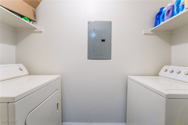 laundry area featuring washer and dryer, electric panel, and laundry area