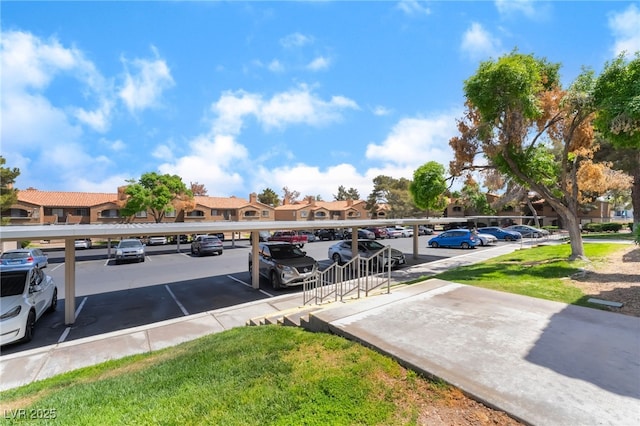 partially covered parking lot with a residential view