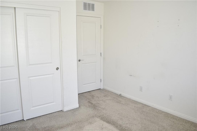 12186 Scarlet Ember Rd Unit 3, Las Vegas, NV 89183 - unfurnished bedroom featuring visible vents, baseboards, carpet floors, and a closet