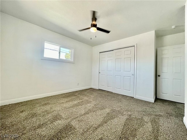 unfurnished bedroom with a closet, baseboards, and carpet