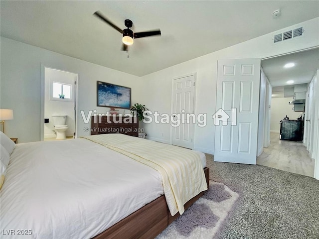 bedroom with baseboards, carpet flooring, a ceiling fan, connected bathroom, and visible vents