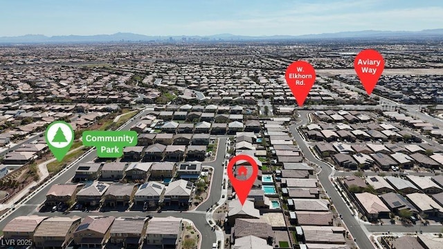birds eye view of property featuring a mountain view and a residential view