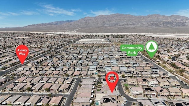 aerial view featuring a mountain view and a residential view