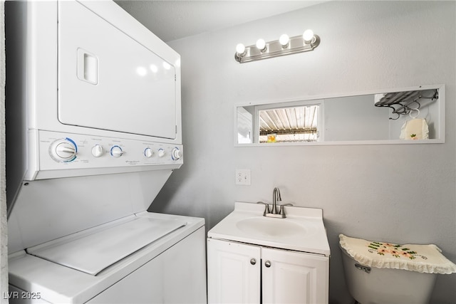 4630 Gabriel Dr, Las Vegas, NV 89121 - clothes washing area with laundry area, a sink, and stacked washer / drying machine