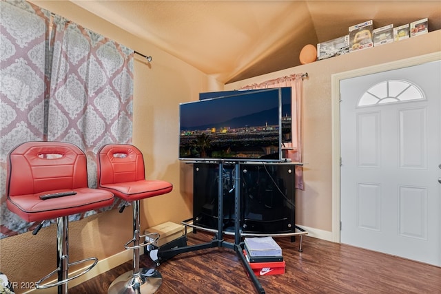 4630 Gabriel Dr, Las Vegas, NV 89121 - entryway with wood finished floors, baseboards, and vaulted ceiling