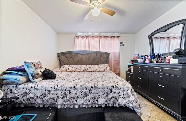 4630 Gabriel Dr, Las Vegas, NV 89121 - bedroom with light tile patterned floors, multiple windows, and a ceiling fan