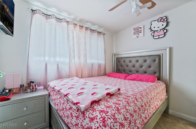 4630 Gabriel Dr, Las Vegas, NV 89121 - tiled bedroom featuring baseboards and a ceiling fan
