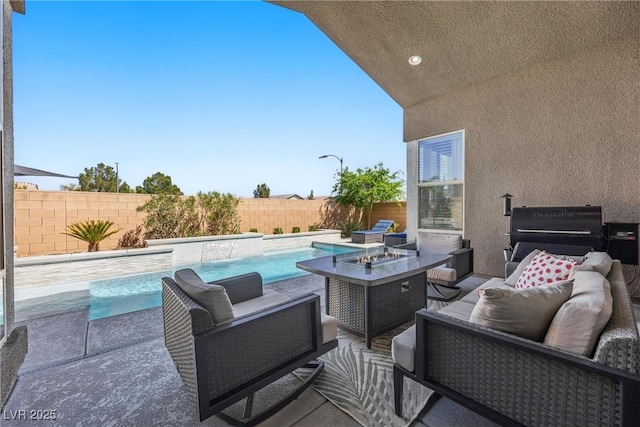 8440 Footpath St, Las Vegas, NV 89166 - fenced backyard featuring an outdoor living space with a fire pit and a patio