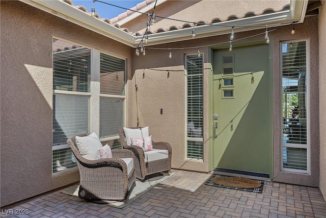 8440 Footpath St, Las Vegas, NV 89166 - property entrance featuring stucco siding, a patio, and a tiled roof