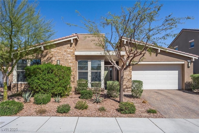 8440 Footpath St, Las Vegas, NV 89166 - mid-century inspired home featuring stone siding, an attached garage, stucco siding, a tiled roof, and decorative driveway