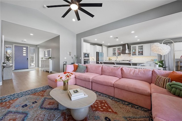 8440 Footpath St, Las Vegas, NV 89166 - living room featuring a ceiling fan, wood finished floors, vaulted ceiling, and recessed lighting