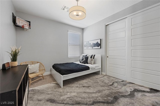 8440 Footpath St, Las Vegas, NV 89166 - carpeted bedroom with baseboards and a closet