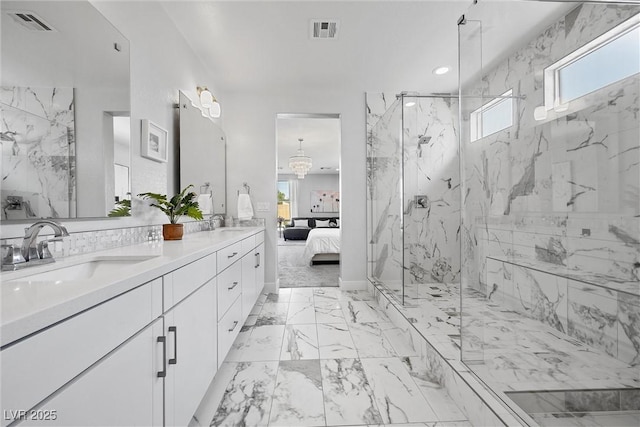 8440 Footpath St, Las Vegas, NV 89166 - ensuite bathroom featuring a marble finish shower, double vanity, marble finish flooring, recessed lighting, and a chandelier