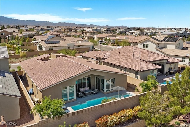 8440 Footpath St, Las Vegas, NV 89166 - rear view of house with a residential view, stucco siding, a fenced backyard, and a mountain view