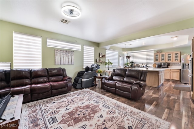 9000 Cotton Rose Way, Las Vegas, NV 89134 - living area with dark wood-type flooring, visible vents, and plenty of natural light