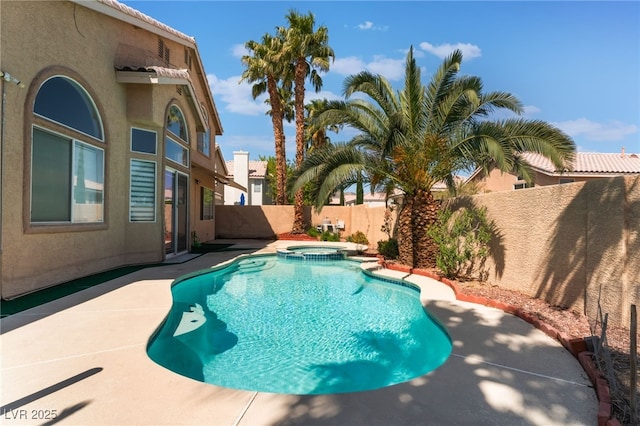 9000 Cotton Rose Way, Las Vegas, NV 89134 - view of pool with a fenced backyard, a pool with connected hot tub, and a patio area