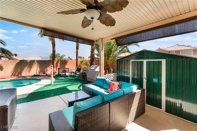 9000 Cotton Rose Way, Las Vegas, NV 89134 - view of patio / terrace with an outdoor hangout area, a fenced backyard, an outdoor structure, a storage unit, and a fenced in pool