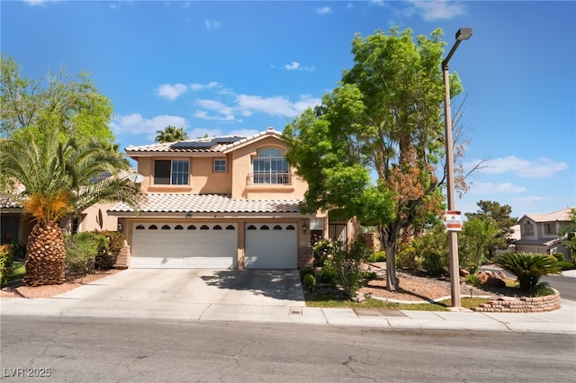 9000 Cotton Rose Way, Las Vegas, NV 89134 - mediterranean / spanish house with solar panels, a garage, a tile roof, concrete driveway, and stucco siding