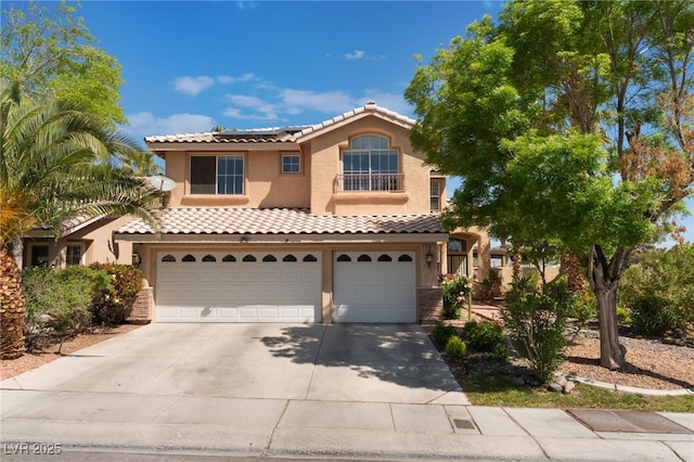 9000 Cotton Rose Way, Las Vegas, NV 89134 - view of front facade featuring stucco siding, driveway, an attached garage, solar panels, and a tile roof