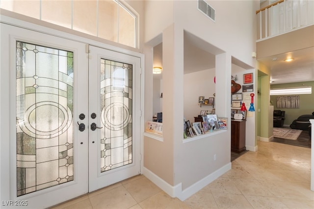 9000 Cotton Rose Way, Las Vegas, NV 89134 - entryway featuring french doors, a high ceiling, light tile patterned floors, and visible vents