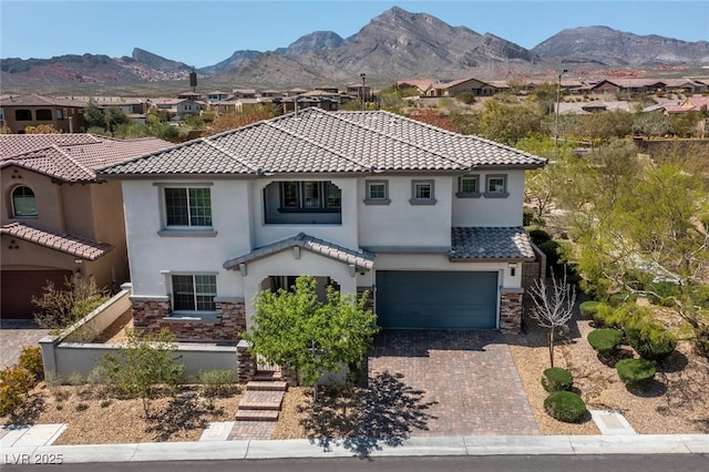 257 Elder View Dr, Las Vegas, NV 89138 - mediterranean / spanish-style house featuring a tile roof, central AC unit, an attached garage, stone siding, and stucco siding