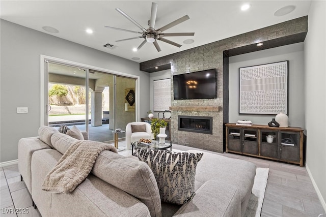 257 Elder View Dr, Las Vegas, NV 89138 - tiled living area featuring baseboards, a ceiling fan, recessed lighting, and a fireplace