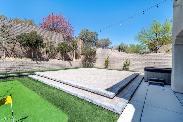 257 Elder View Dr, Las Vegas, NV 89138 - fenced backyard with a hot tub and a patio