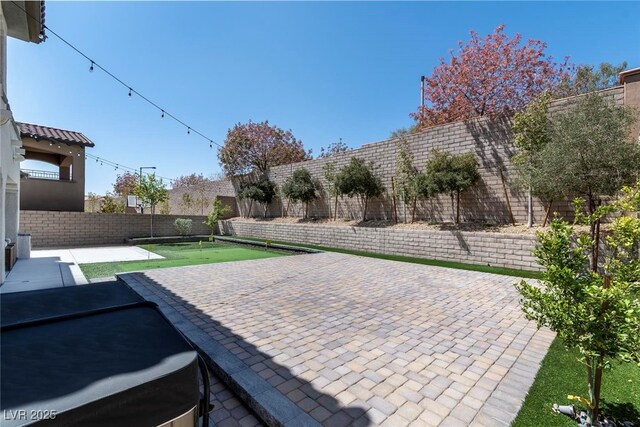 257 Elder View Dr, Las Vegas, NV 89138 - fenced backyard featuring a patio area and an area to practice putting
