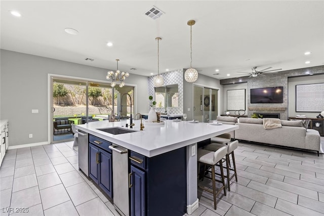 257 Elder View Dr, Las Vegas, NV 89138 - kitchen with blue cabinets, light countertops, recessed lighting, a sink, and a ceiling fan