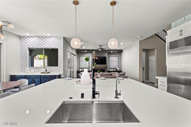 257 Elder View Dr, Las Vegas, NV 89138 - kitchen with blue cabinets, built in fridge, light countertops, ceiling fan, and recessed lighting