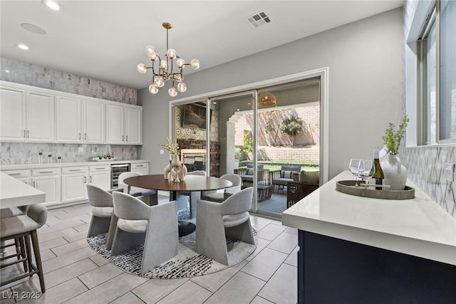 257 Elder View Dr, Las Vegas, NV 89138 - dining space with a chandelier, plenty of natural light, beverage cooler, and recessed lighting