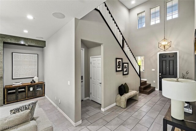 257 Elder View Dr, Las Vegas, NV 89138 - entrance foyer with stairs, healthy amount of natural light, recessed lighting, baseboards, and a towering ceiling